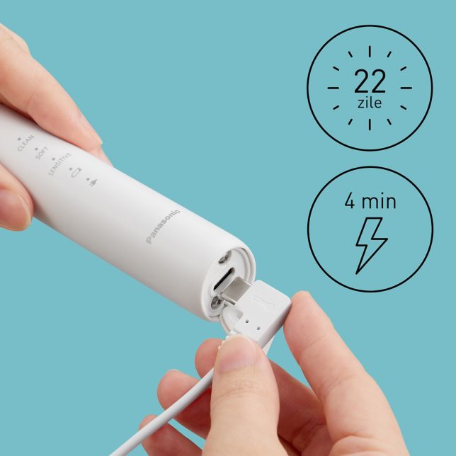 Prim-plan cu un cablu USB Type-C conectat la periuța de dinți electrică pentru încărcare