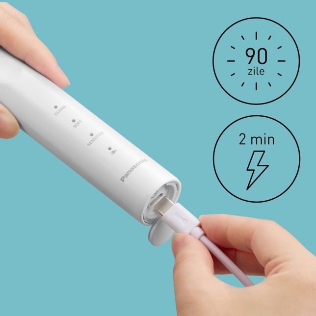 Prim-plan cu un cablu USB Type-C conectat la periuța de dinți electrică pentru încărcare